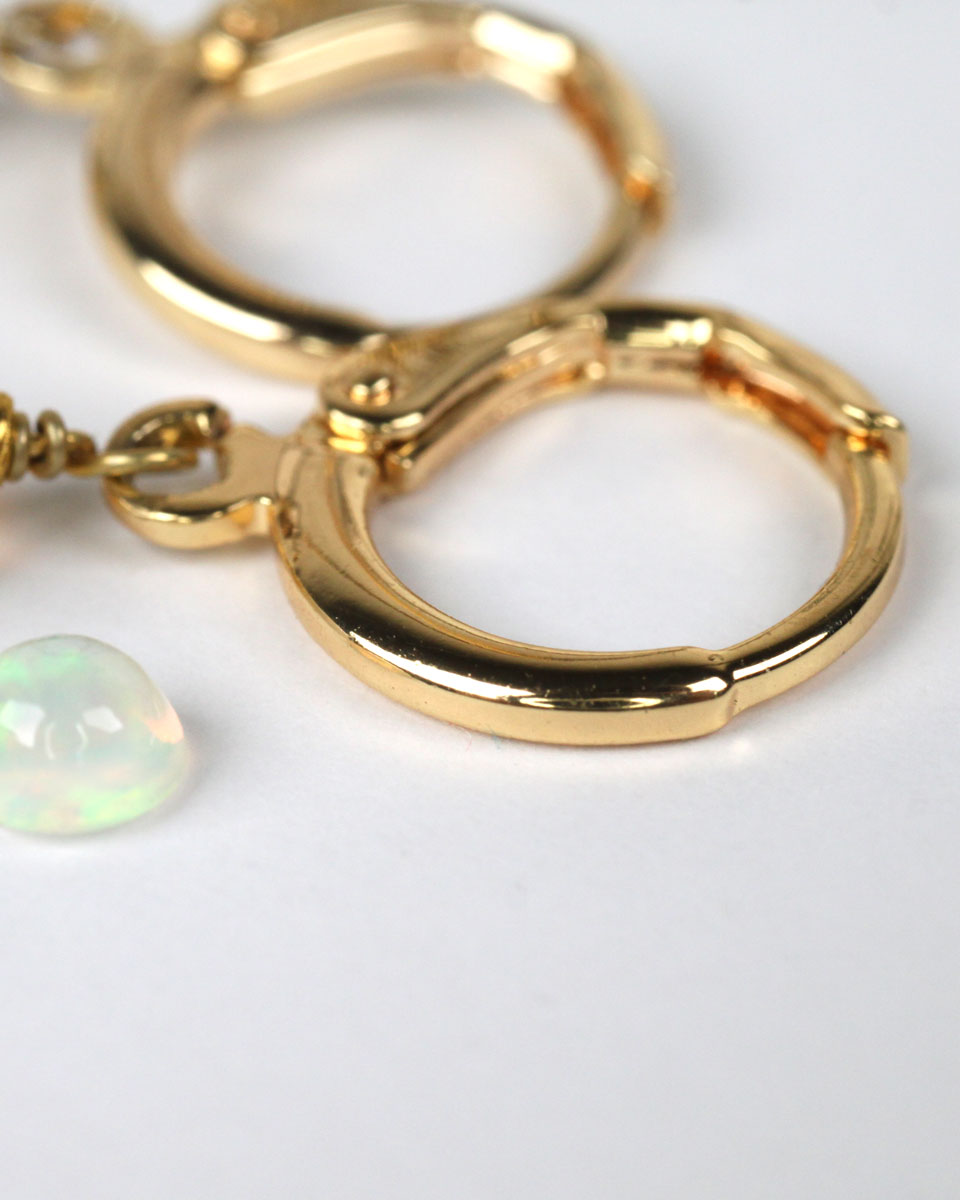 White jade earrings with 3 Wollo opals