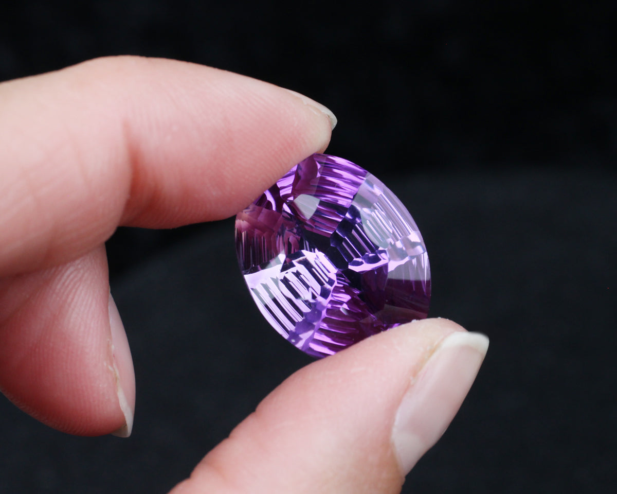 Amethyst oval stepcut 21 mm 21 ct