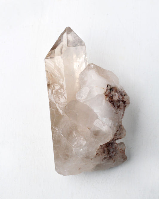 Smokey quartz crystal on a white background
