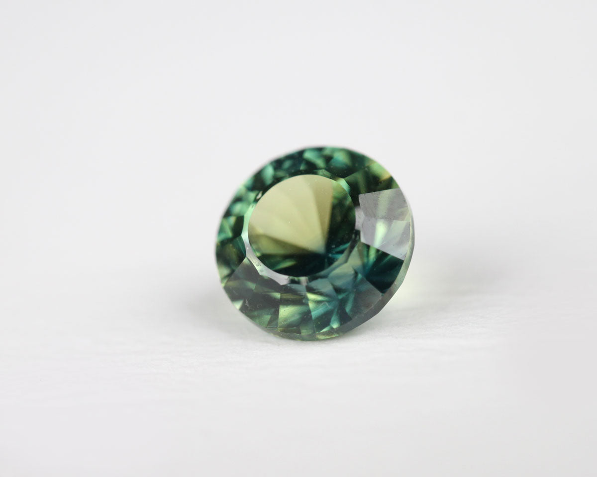 Safir blå/gul rund 5 mm 0,61 ct