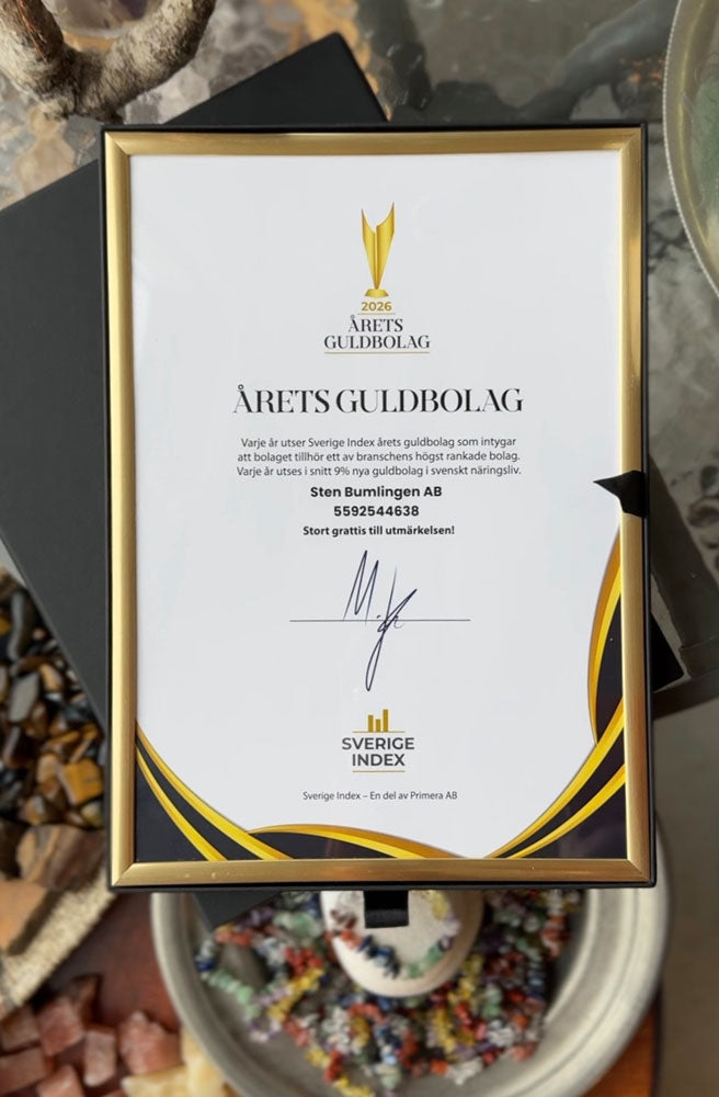 Awards certificate with gold and black frame on a textured surface