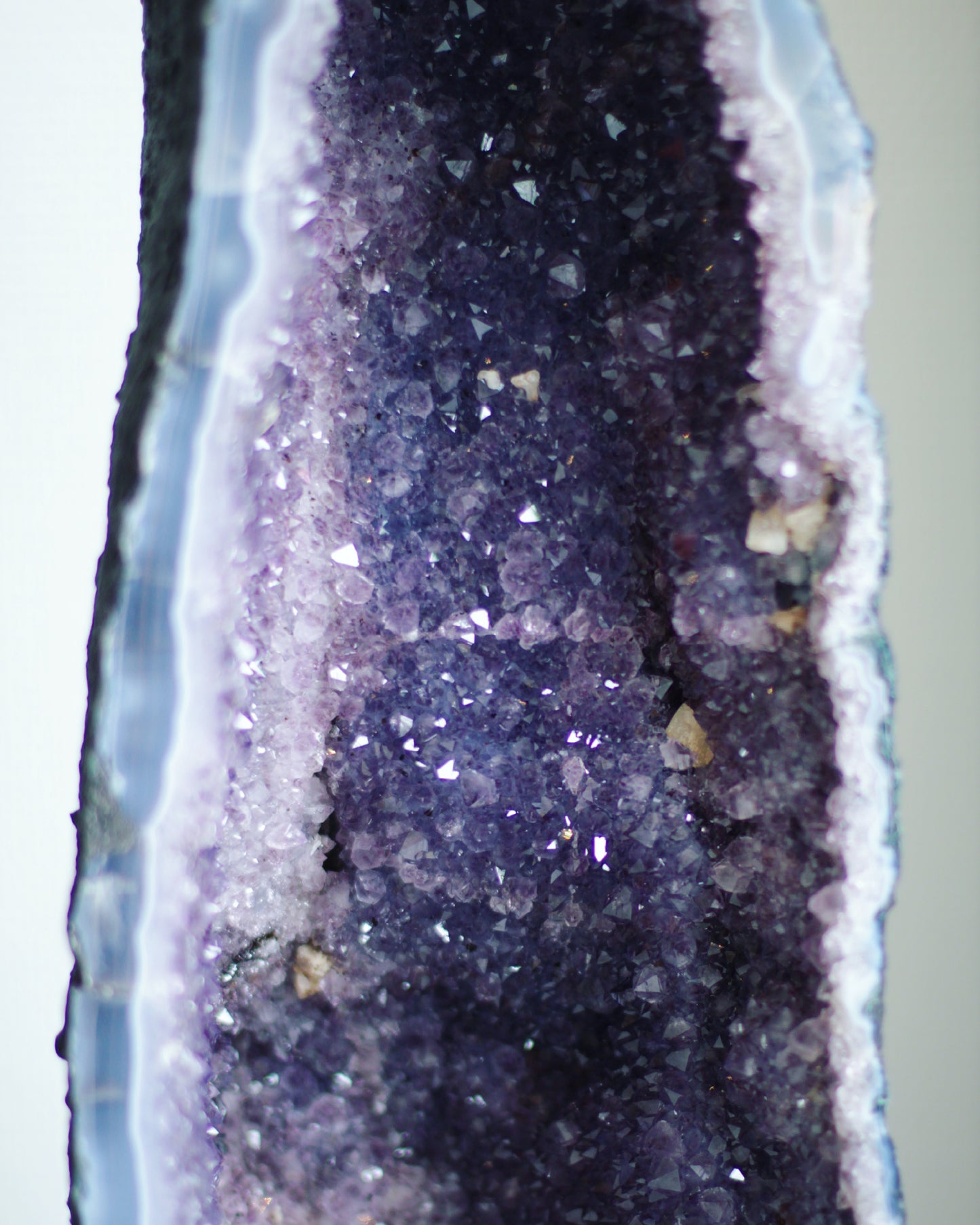 Large Amethyst Cave/Geod with calcite crystalls, close up